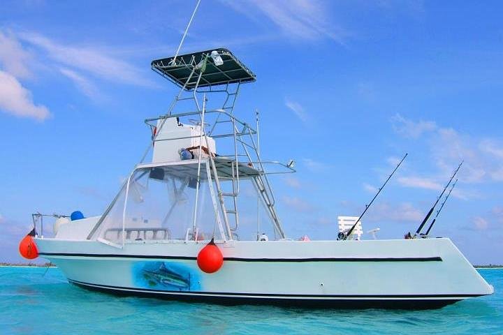 Deep Sea Fishing Cozumel Charter Boat with anglers catching fish in Caribbean waters